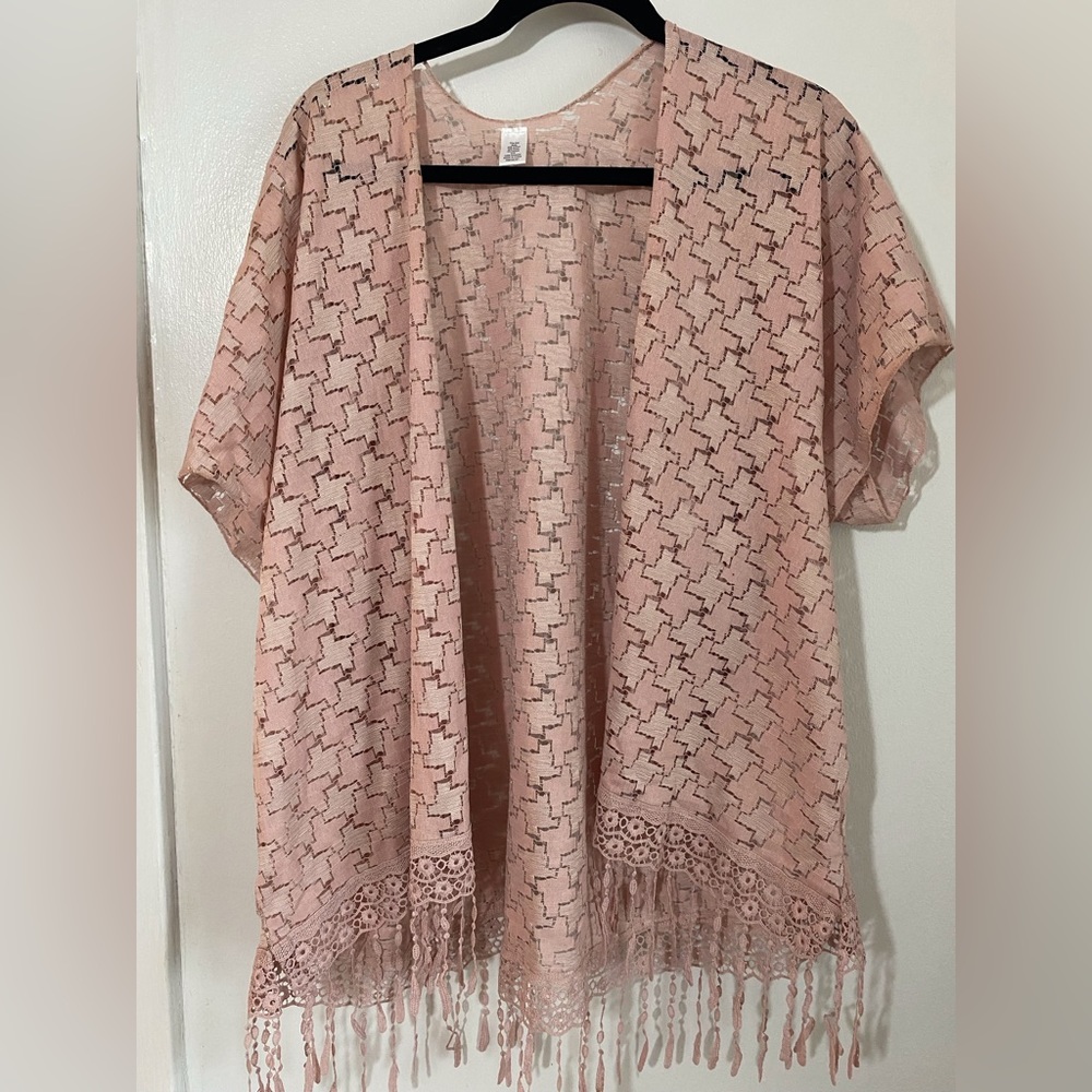 Pink short kimono cardigan style with fringed bottom.